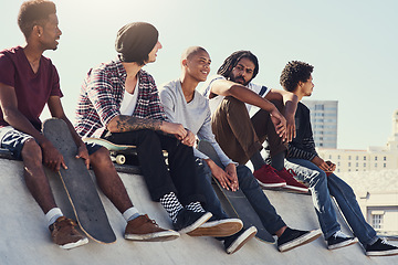Image showing Skating is our way of life. Full length shot of a group of young skaters sitting together on a ramp at a skatepark.