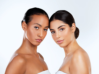 Image showing Why be like everyone else when you can be you. Studio shot of beautiful young women posing against a grey background.