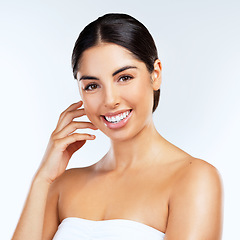 Image showing Glowing heart, glowing skin. Studio shot of beautiful young women posing against a grey background.