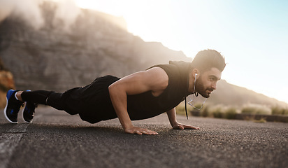 Image showing You earn so much more when you dont give up. a sporty young man doing pushups while exercising outdoors.