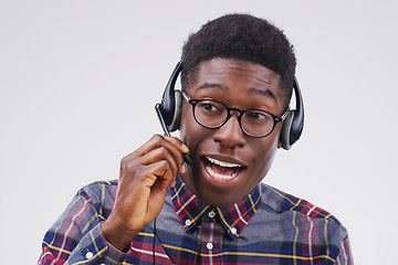 Image showing Perfectly skilled at creating an overall positive customer experience. Studio shot of a handsome young male customer service representative wearing a headset against a grey background.