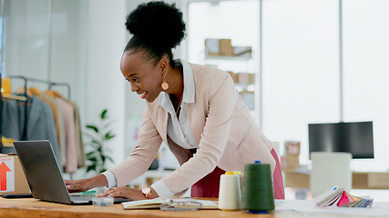 Image showing Happy black woman, laptop and fashion designer in small business, office or ideas at boutique store. African female person smile working on computer in logistics for clothing or schedule delivery