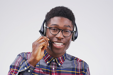 Image showing Got a question I’m here to answer it. Studio portrait of a handsome young male customer service representative wearing a headset against a grey background.