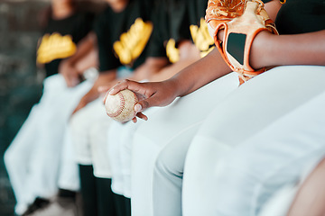 Image showing Baseball season just started. a group of young baseball players sitting together on the bench during a game.