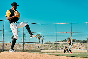 Image showing Three strikes and youre out. a young baseball player getting ready to pitch the ball during a game outdoors.