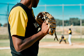 Image showing This pitch will make or break him. a young baseball player getting ready to pitch the ball during a game outdoors.