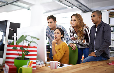 Image showing Perfecting everything they work on. A young team of design professionals having a meeting.