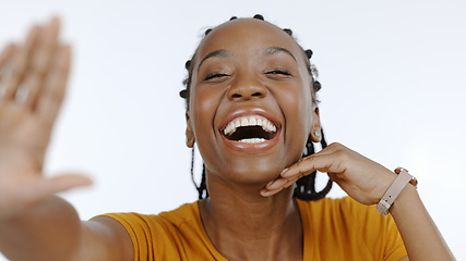 Image showing Black woman, portrait and smile in studio for selfie, live streaming vlog and content creation isolated on white background. Happy african model, laugh and profile picture for social media broadcast