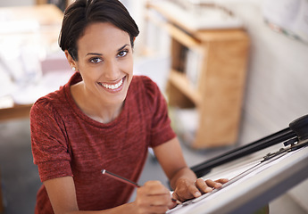 Image showing Im all about satisfying the client. an attractive young architect working in her office.