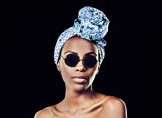 Image showing In order to be irreplaceable, one must be different. Studio shot of a beautiful woman wearing a headscarf against a black background.