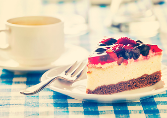 Image showing Cake on plate with fork and coffee cup