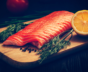 Image showing Fresh salmon piece on wooden board