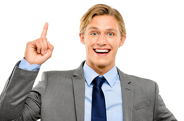 Image showing I have a brilliant idea. a handsome young businessman standing alone in the studio and pointing upwards.