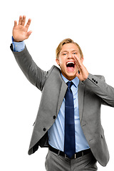 Image showing Hey, can I have your attention. a handsome young businessman standing alone in the studio and yelling.