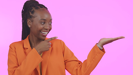 Image showing Black woman, branding and pointing for advertising on mockup space in studio for product placement. Happy, person and promotion for business, marketing or offer on pink background or presentation