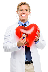 Image showing I can hear your heart loud and clear. a handsome young doctor standing alone in the studio and using a stethoscope on a balloon heart.