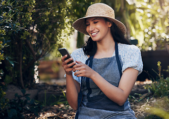Image showing Eat food. Not too much. Mostly plants. a young florist using her smartphone to send a text.