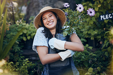 Image showing We were plants we learnt to survive. a young female florist working at a nursery.