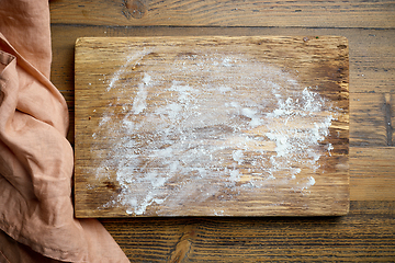 Image showing flour on wooden cutting board