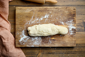 Image showing dough on wooden cutting board