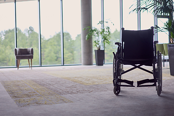 Image showing A wheelchair in a modern, spacious office, symbolizing inclusivity and accessibility for business meetings.