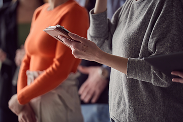 Image showing Closeup photo of a woman using a smartphone