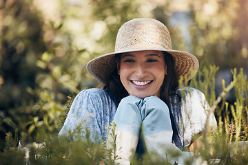 Image showing If a tree dies, plant another in its place. a young female florist working at a nursery.