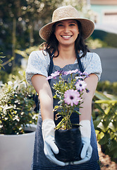 Image showing Good health and a sense of well being. a young female florist working at a nursery.