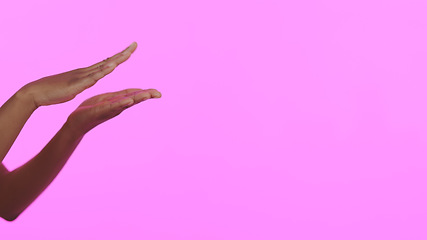 Image showing Hands, beauty and mockup with a person on a pink background in studio for advertising or marketing. Skincare, banner and space with a model closeup on a color wall for a salon or spa treatment