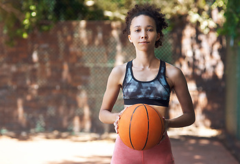 Image showing My court, my rules. Cropped portrait of an attractive young female athlete standing on the basketball court.