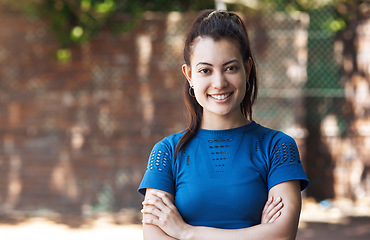 Image showing Ive got confidence in my game. Cropped portrait of an attractive young female athlete standing with her arms folded on the basketball court.