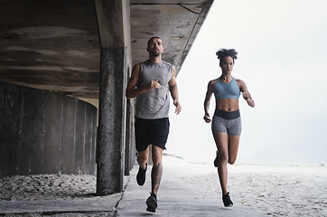 Image showing We always run further together. Full lengths shot of a sporty young couple running together outdoors.