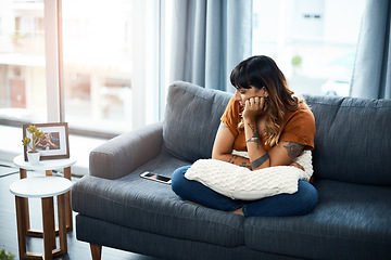 Image showing Im still waiting on his call. a woman looking upset while staring at her cellphone.