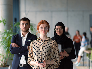 Image showing A group of young business entrepreneurs engages in a lively discussion within the office, exemplifying the spirit of teamwork, innovation, and ambition in pursuit of success.