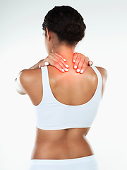 Image showing When I work too hard this what happens. Rearview studio shot of an unrecognizable woman holding her neck due to pain while standing against a white background.