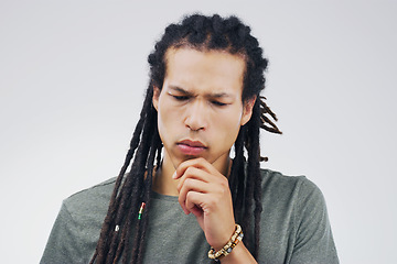 Image showing Wait a minute...Studio shot of a young person looking thoughtful against a gray background.