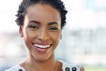 Image showing Shes full of self confidence. Cropped portrait of an attractive young businesswoman smiling while standing in a modern office.