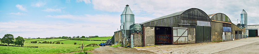 Image showing Farmland landscape. a dairy factory on wide open farmland in the countryside.