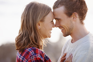 Image showing Face to face with the one she loves. an attractive young couple standing face to face.