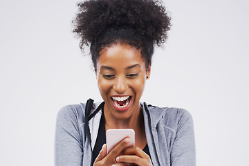 Image showing Im so excited for this high school reunion. a young woman reading something on her cellphone.