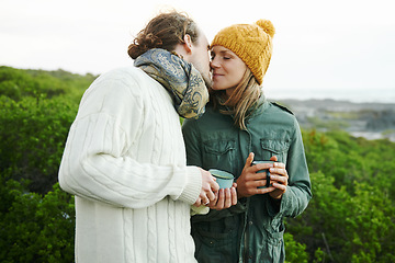 Image showing Nature brings out their romantic side. an affectionate young couple kissing outside.