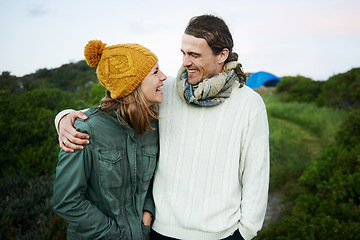 Image showing He can always make her laugh. an affectionate young couple standing together outdoors.