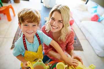 Image showing Play helps kids use their creativity while developing their imagination. Portrait of a mother and son having fun together at home.