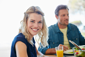 Image showing Sharing moments and meals together. Portrait of a young woman enjoying a meal together with her husband at home.