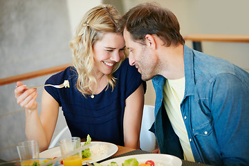 Image showing Love makes everything taste ten times better. a couple enjoying a meal together at home.