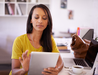 Image showing Scheduling my appointments has never been so easy...A young businesswoman working on a digital tablet.