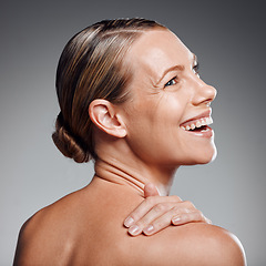 Image showing Beautiful mature woman posing in studio against a grey background