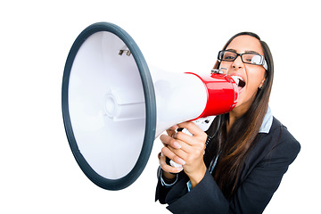 Image showing Empty vessels make the most noise. a young businesswoman shouting into a megaphone against a studio background.