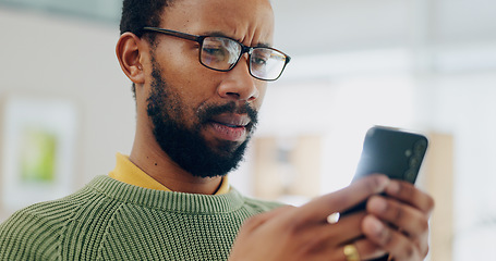 Image showing Reading email, black man and a phone for communication, online chat or app notification. Home, contact and an African person typing on a mobile for a search, website or connection on the internet