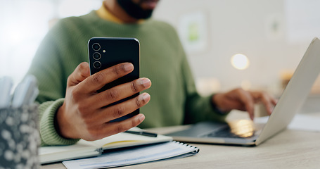 Image showing Phone, laptop and hands multitask or typing for work, online and man with project notebook on desk. Cellphone, app and businessman check information, email or research notes on internet and computer